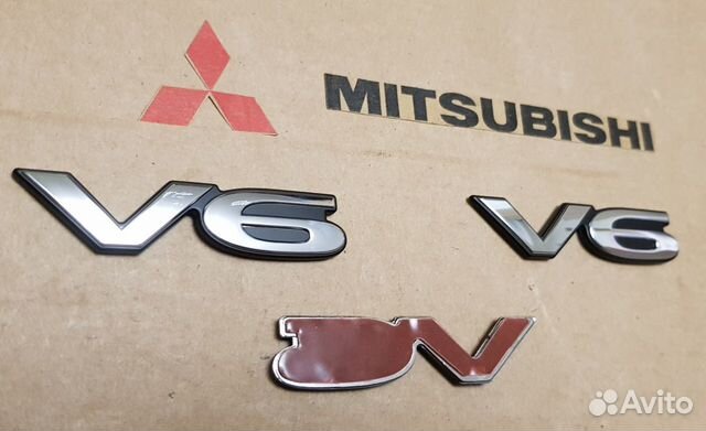 MB814468 Mitsubishi V6 эмблема mb814468 MB814468 Mitsubishi V6 эмблема mb814468